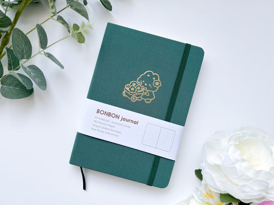 Forest Green Bullet Journal Notebook with Dotted Pages - Bunny Bonbon Design in Gold Foil Holding Flower Cart
